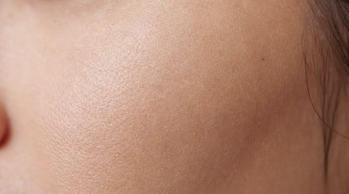 Close-up of smooth, hydrated skin texture on a woman's cheek